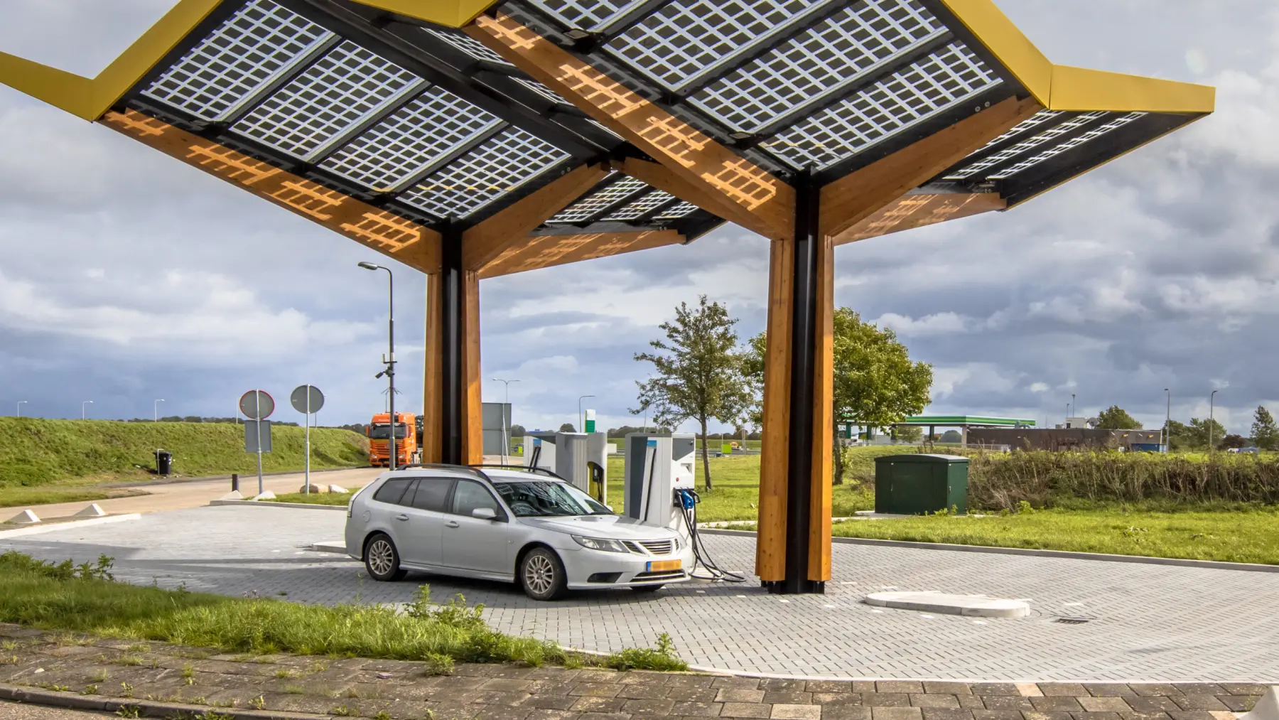 Electric car at a charging station under a solar canopy